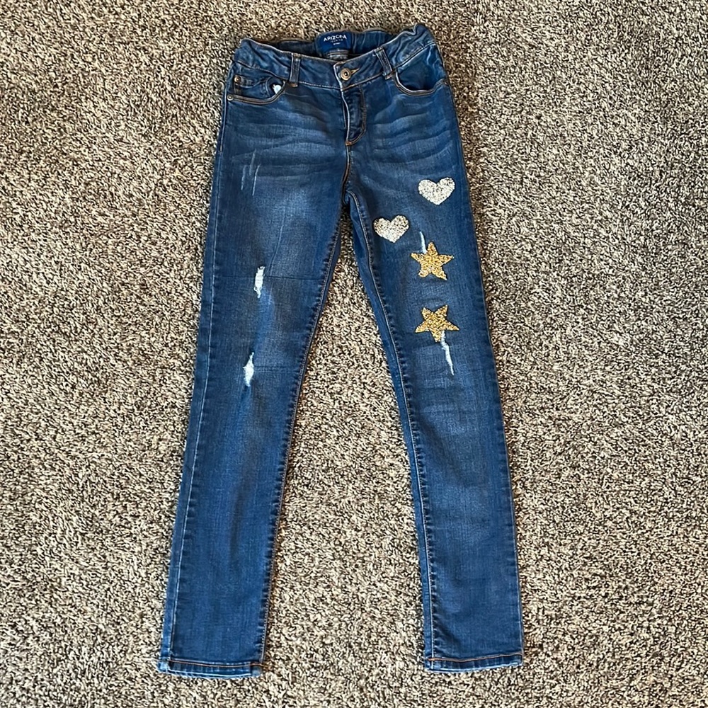 Girl size 12 Arizona jeans 👖inside adjustable waist strap’s.
